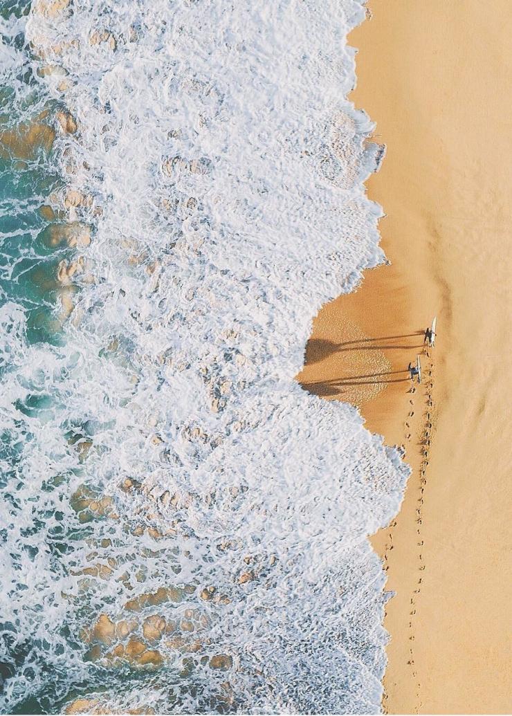 Vue aérienne de surfeurs à Palm Beach près de Sydney © Adam Krowitz