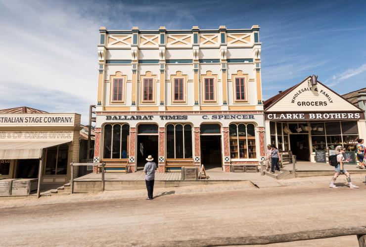 People wandering along a road lined with historic buildings in Sovereign Hill, Ballarat, Victoria © Visit Victoria