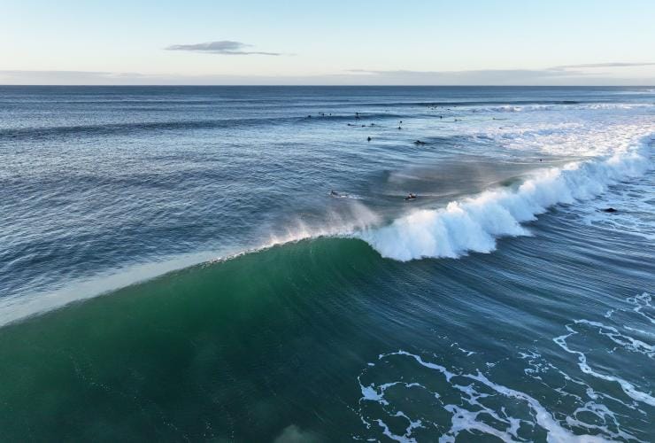 Aerial view of a a barrel-shaped wave crashing at Bells Beach, Great Ocean Road, Victoria © Tourism Australia/Visit Victoria