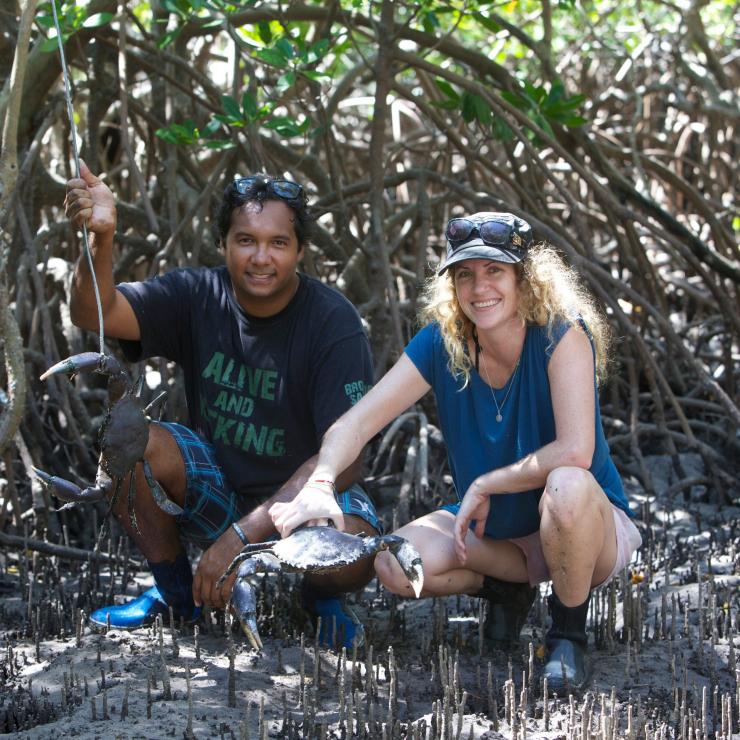 Visitor with a freshly-caught mud crab during a Lombadina tour in the Dampier Peninsula © Lombadina/Leon Mead