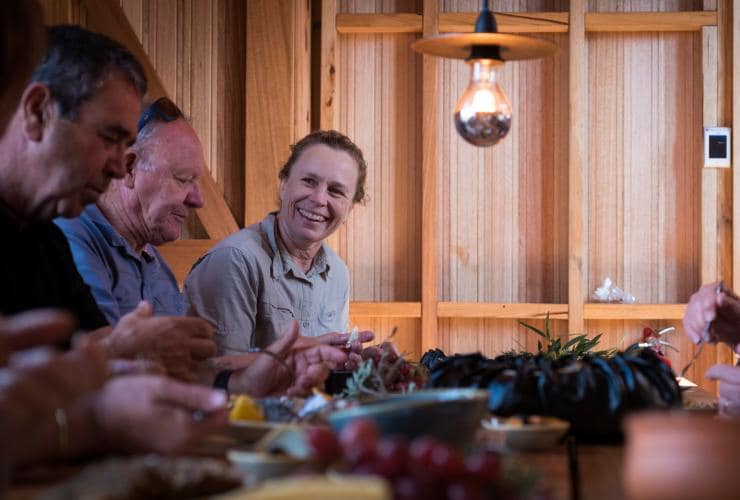 Hikers on the Wukalina Walk enjoying a meal together © Tourism Tasmania/Rob Burnett