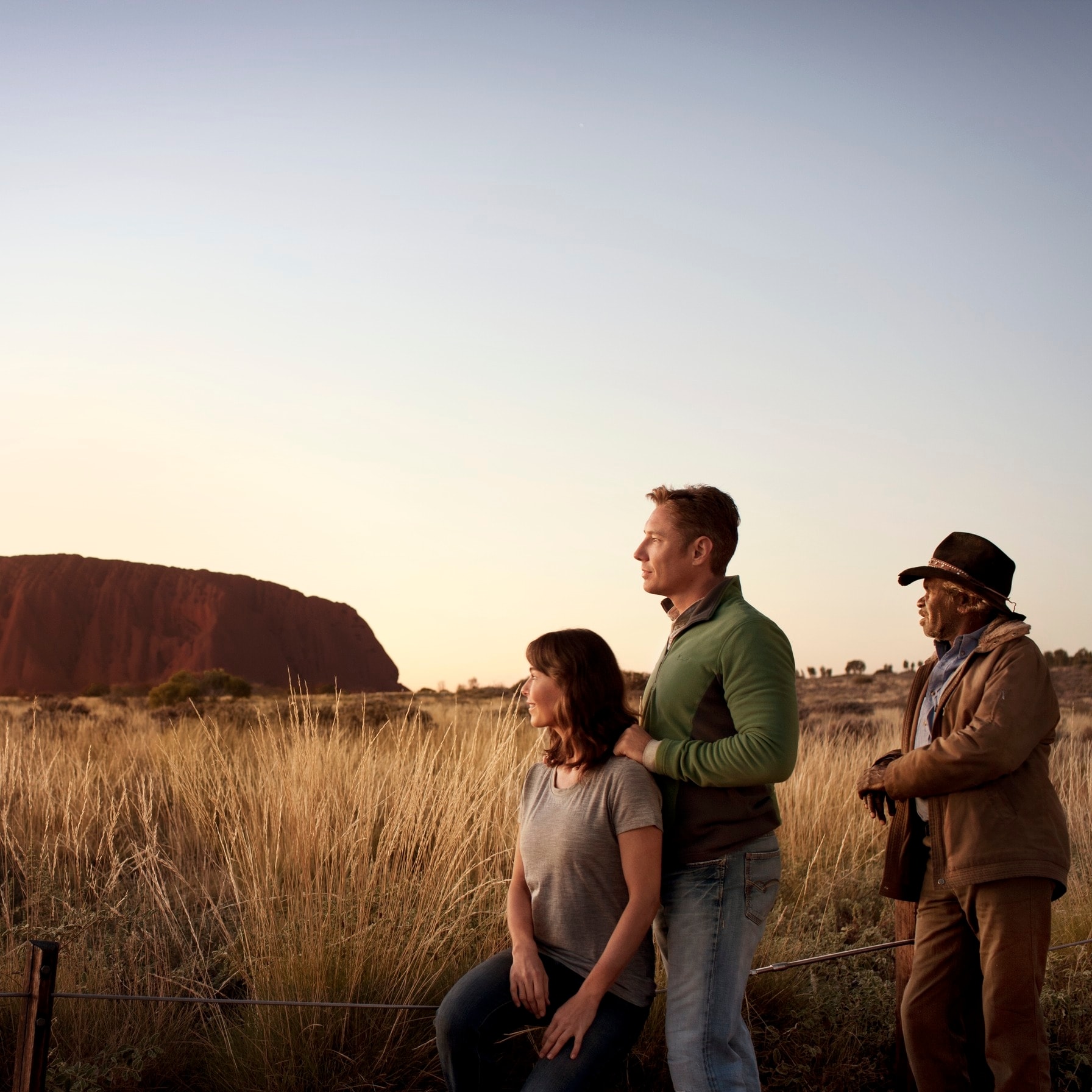 Group in Uluru Kata Tjuta National Park with Uluru in the background © Tourism Australia