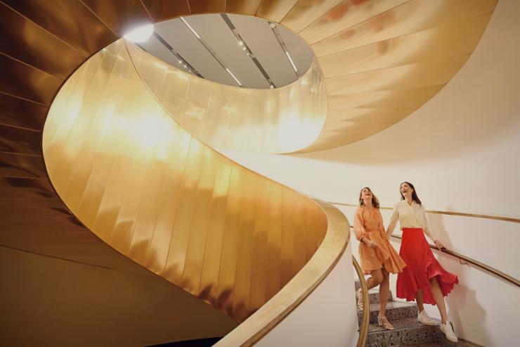 Two women laughing together while walking down a spiral staircase at WA Museum Boola Bardip, Perth, Western Australia © Tourism Western Australia Two women laughing together while walking down a spiral staircase at WA Museum Boola Bardip, Perth, Western Australia © Tourism Western Australia