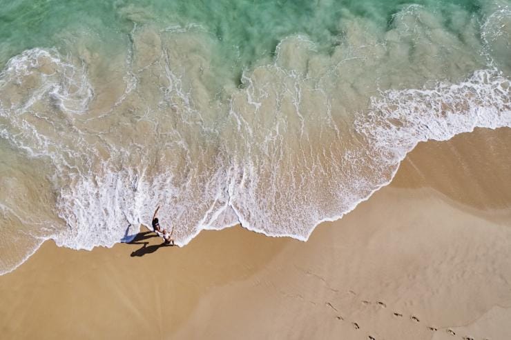 Aerial of two swimmers approaching the shoreline at City Beach, Perth, Western Australia © Tourism Western Australia Aerial of two swimmers approaching the shoreline at City Beach, Perth, Western Australia © Tourism Western Australia