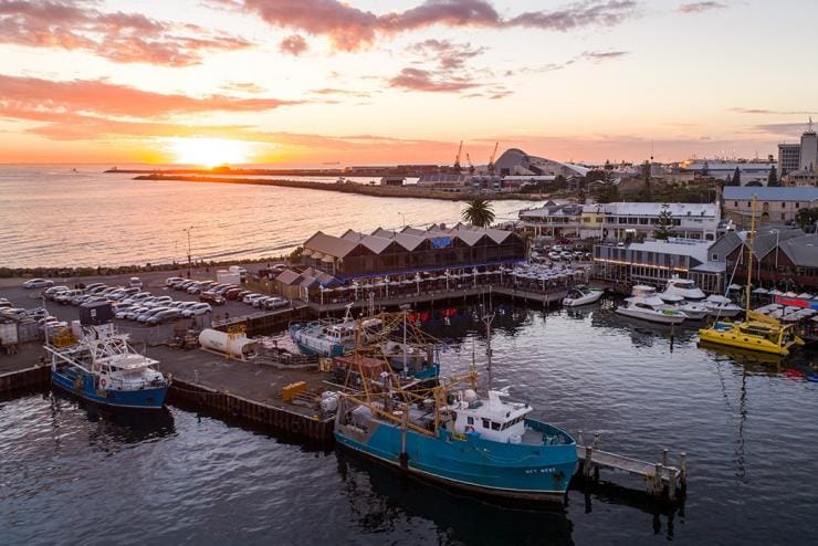 Aerial view of boats and buildings lining the pier at Fremantle Boat Harbour during sunset, Fremantle, Western Australia © Tourism Australia Aerial view of boats and buildings lining the pier at Fremantle Boat Harbour during sunset, Fremantle, Western Australia © Tourism Australia