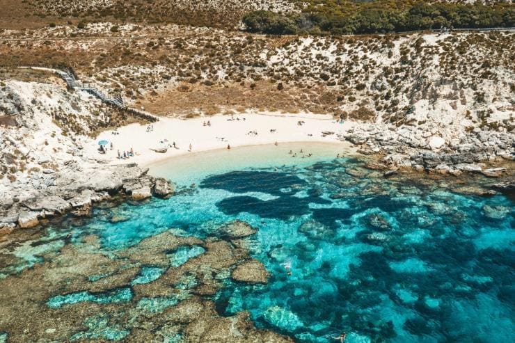 People snorkelling and swimming among the bright blue waters and coral of Armstrong Bay, Rottnest Island, Western Australia © Tourism Australia People snorkelling and swimming among the bright blue waters and coral of Armstrong Bay, Rottnest Island, Western Australia © Tourism Australia
