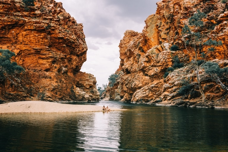 Relaxing at Ellery Creek Big Hole, West MacDonnell Ranges, NT © Tourism NT, Laura Bell