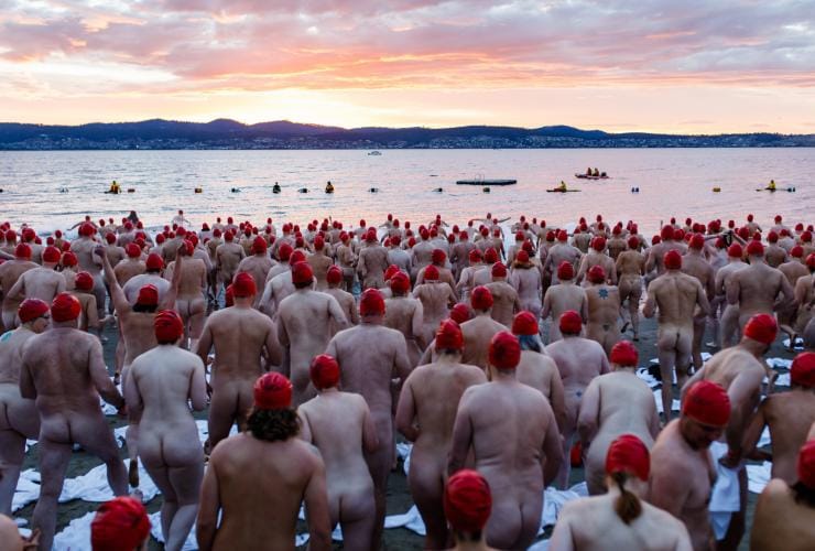 Swimmers on the beach for the Nude Solstice Swim in Hobart © Dark Mofo/Jesse Hunniford