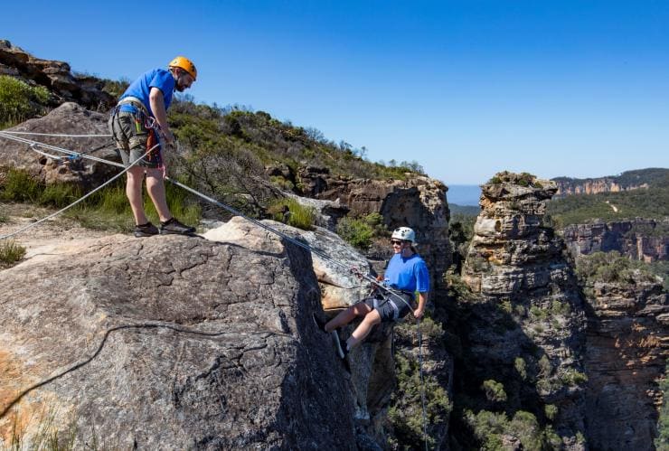 Woman abseiling at Cahills Lookout, Katoomba in the Blue Mountains © Destination NSW