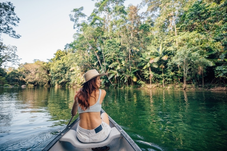 Lady kayaking on the Mossman River, Mossman, QLD © Tourism and Events Queensland