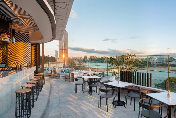 A rooftop bar overlooking a city skyline during sunset, WET Deck, The W Hotel, Brisbane, Queensland © Brisbane Economic Development Agency