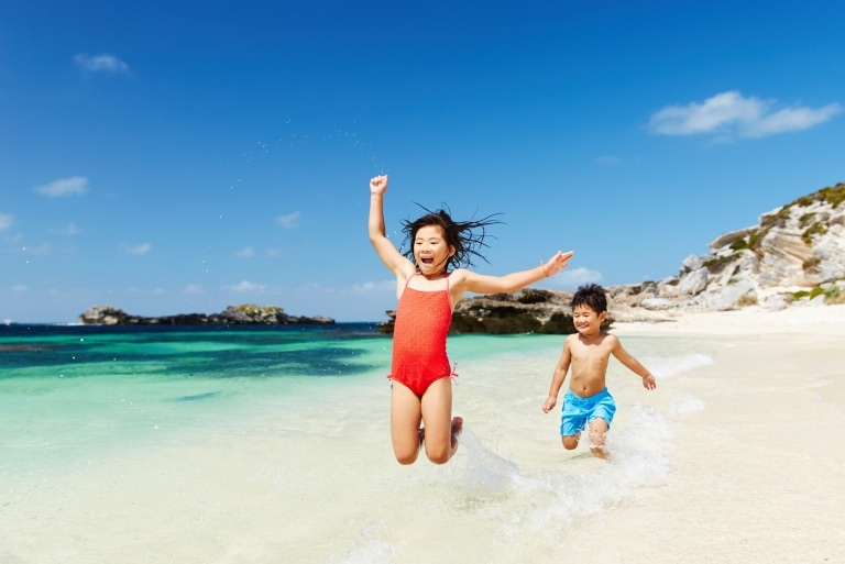 Two children playing on the beach at Rottnest Island © Rottnest Island Authority