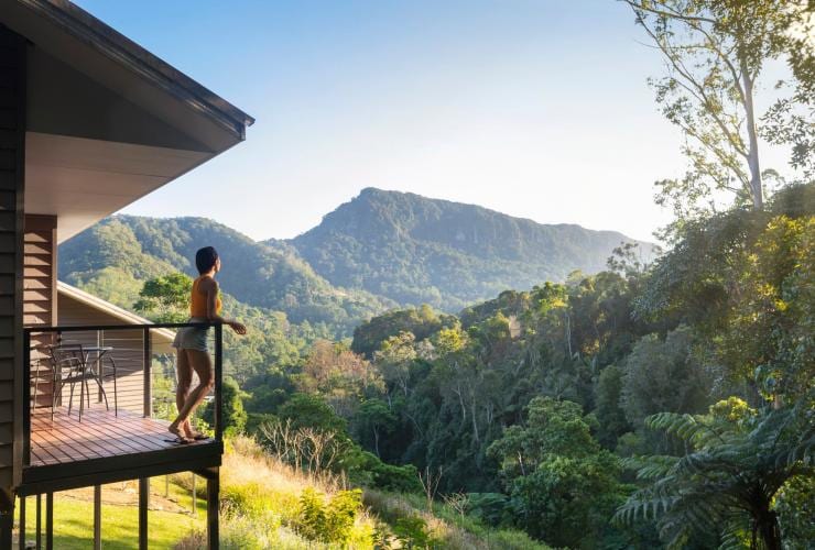 Woman on balcony looks out over the Currumbin Valley at Eden Health Retreat © Eden Health Retreat