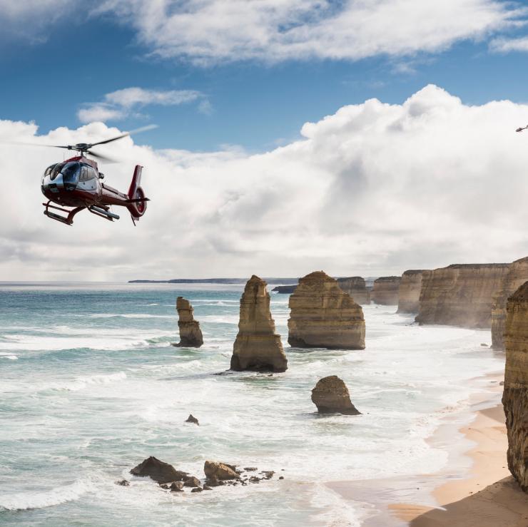Helicopter flies above the 12 Apostles © Visit Victoria