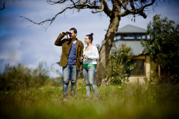 Couple outside The Great Ocean Ecolodge, Apollo Bay © Visit Victoria