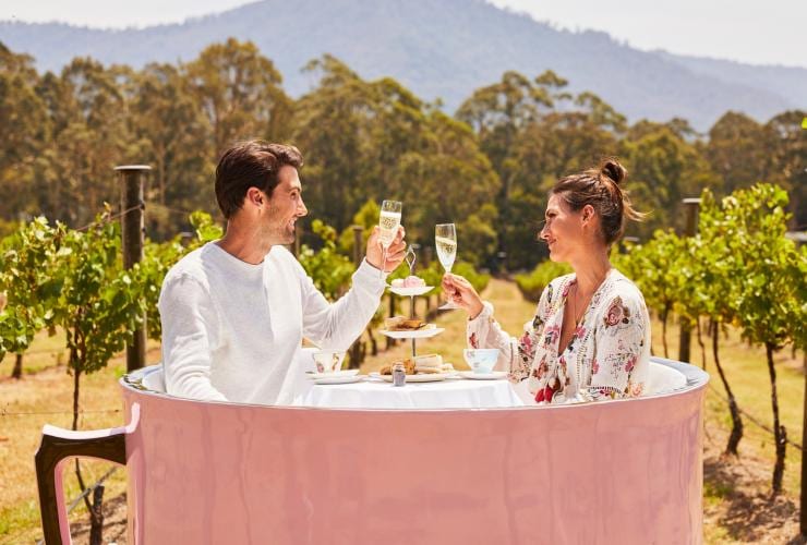  Couple clinks their glasses of champagne at Cambewarra Estate Winery © Destination NSW