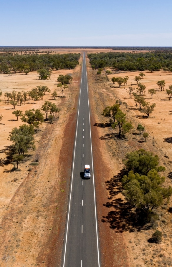  Car drives along the Matilda Way in Outback Queensland © Tourism and Events Queensland