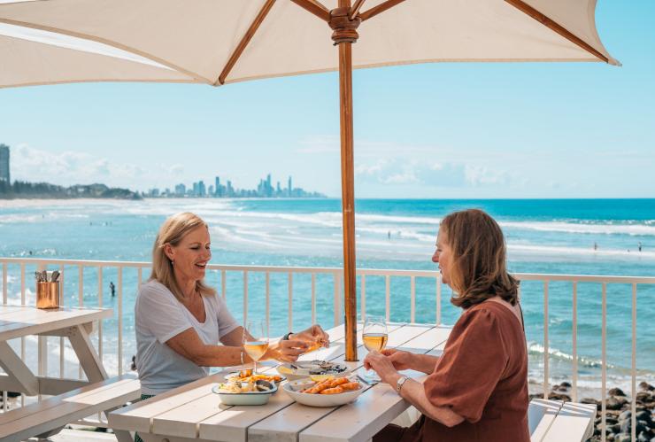 Women dining at Burleigh Pavilion on the Gold Coast © Destination Gold Coast