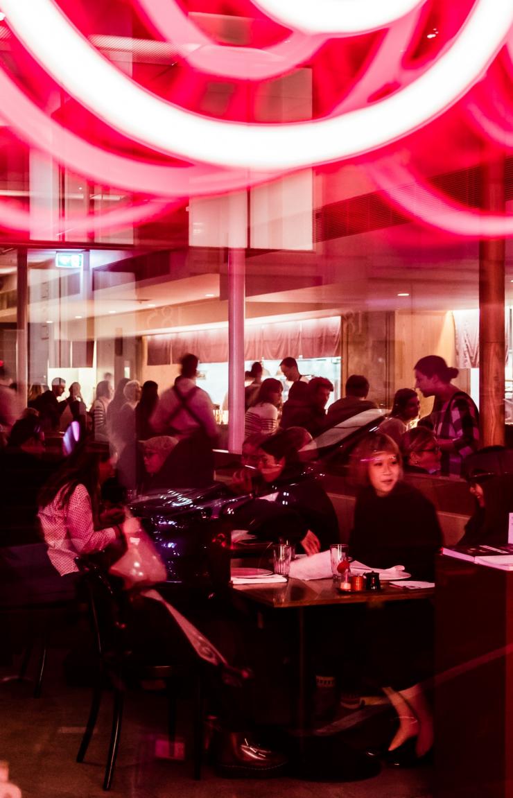 Bright neon lights and people fill out Supernormal, Melbourne © Trader House Restaurants, Nikki To