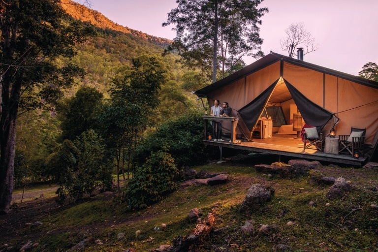 Couple at Nightfall Wilderness Camp in Lamington National Park © Tourism & Events Queensland