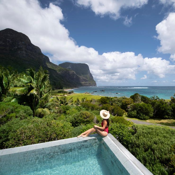 Woman relaxing by the pool at Capella Lodge, Lord Howe Island in New South Wales © tom-archer.com
