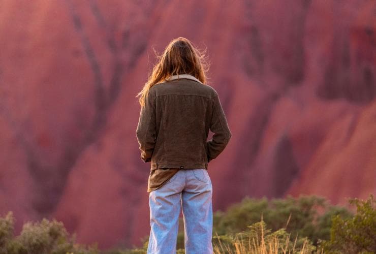 Woman viewing Uluru, Northern Territory © Tourism NT/Plenty of Dust