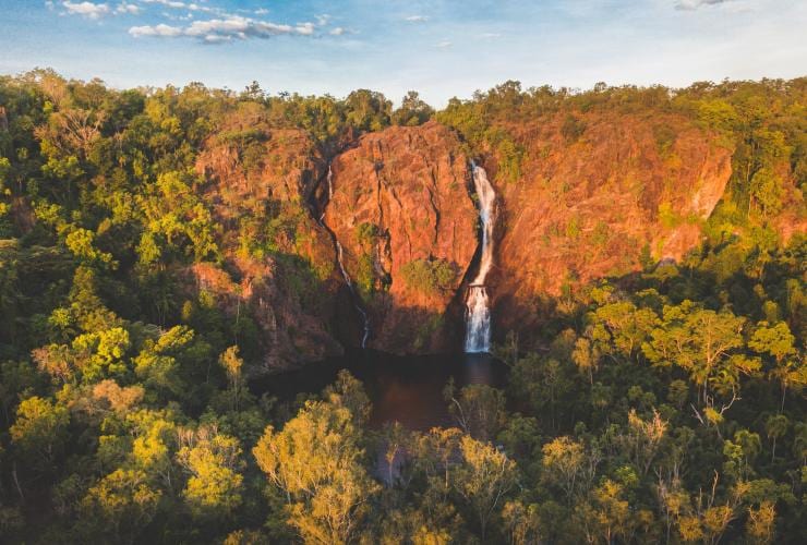 Wangi Falls against red cliffs in Litchfield National Park © Tourism NT/Lucy Ewing 