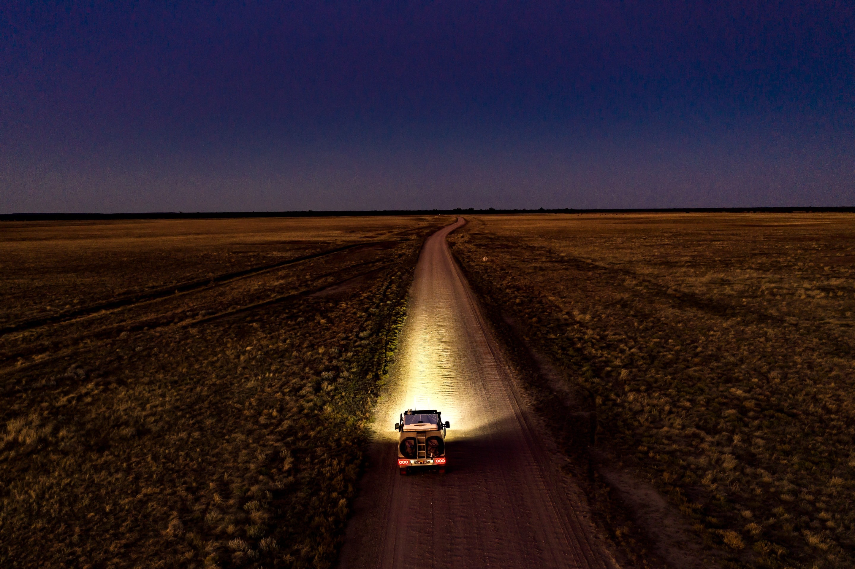 Car driving at night along the Outback Way © Tourism and Events Queensland