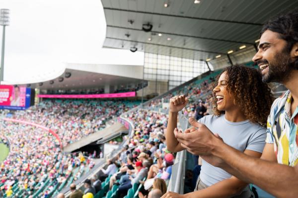 Friends cheering in the stands at Sydney Cricket Ground, Sydney, New South Wales © Destination NSW