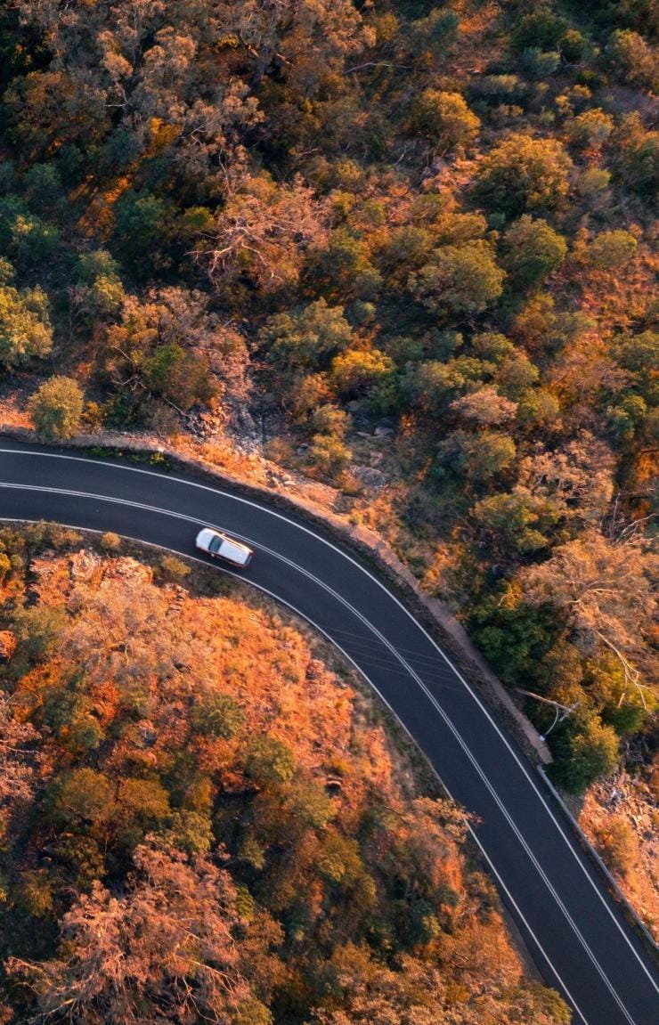 Aerial overlooking a car driving through the countryside near Tamworth, New South Wales © Destination NSW