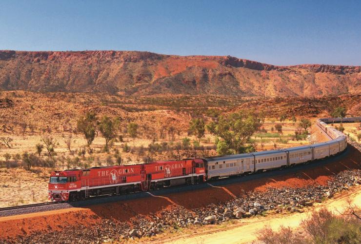 The Ghan train travelling through the MacDonnell Ranges © Great Southern Rail