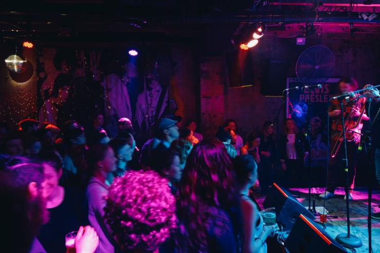 A group of people dancing under purple lights in front of a band on a stage at Cherry Bar, Melbourne, Victoria © Visit Victoria A group of people dancing under purple lights in front of a band on a stage at Cherry Bar, Melbourne, Victoria © Visit Victoria