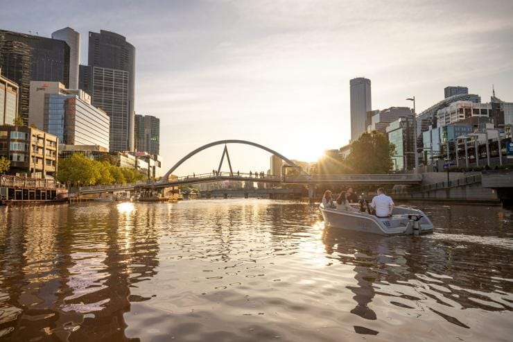 A group of people driving a GoBoat down the Yarra River surrounded by the buildings of Melbourne’s skyline, Victoria © Tourism Australia A group of people driving a GoBoat down the Yarra River surrounded by the buildings of Melbourne’s skyline, Victoria © Tourism Australia