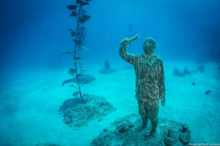 Underwater sculpture exhibit in the Museum of Underwater Art near Townsville © Matt Curnock