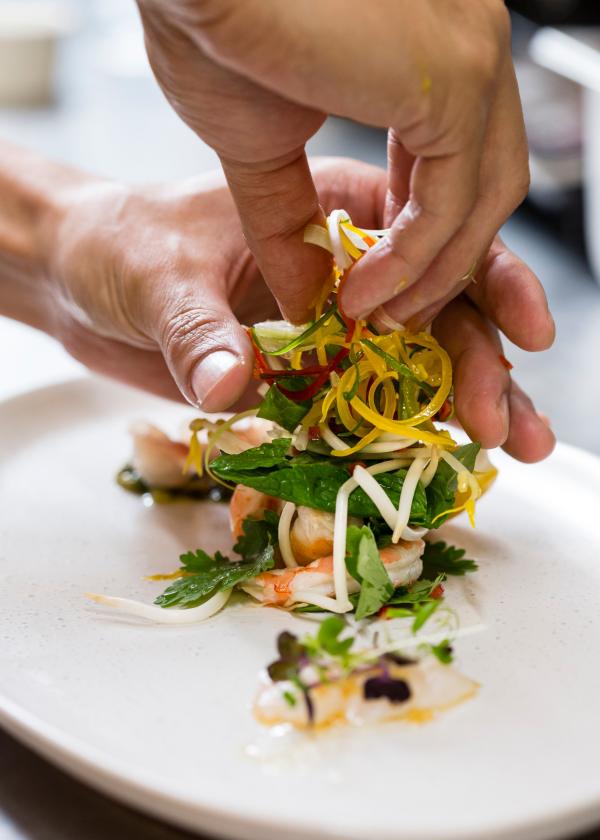 Plating a meal at Pee Wee's at the Point, Darwin, NT © Tourism NT