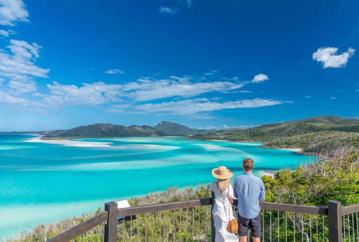 Couple admire view over the Whitsundays from Hill Inlet © Riptide Creative