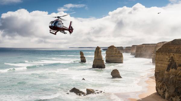 Helicopter over the 12 Apostles, Great Ocean Road, VIC © Visit Victoria