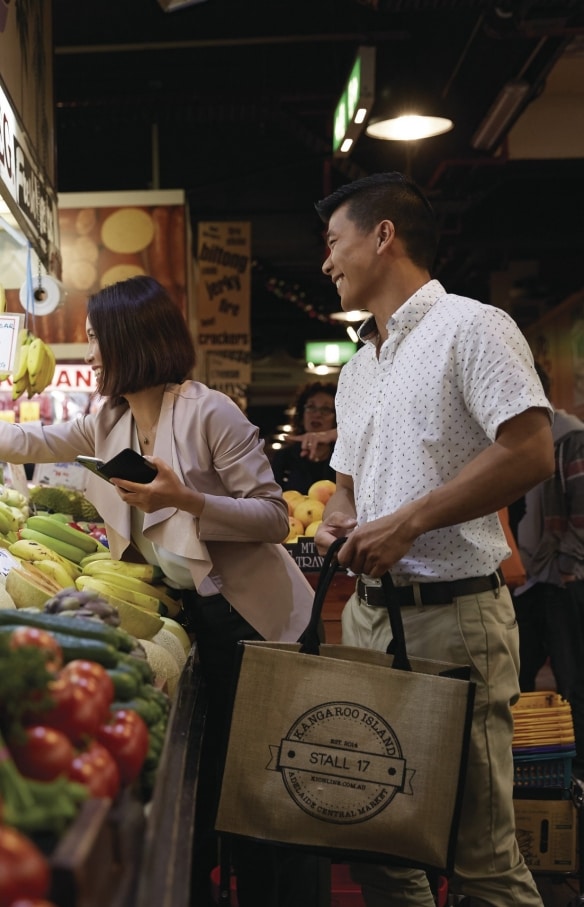 Couple purchasing produce at the Adelaide Central Market , Adelaide, South Australia © Ryan Cantwell