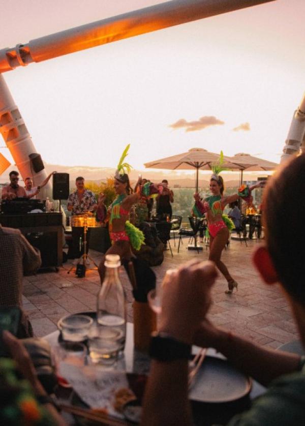 Performers dancing in front of a live band at a rooftop bar during sunset, Soko, Brisbane, Queensland © Brisbane Economic Development Agency