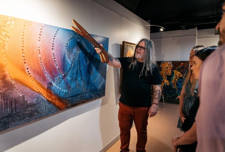  Looking at the art with artist at Birrunga Gallery & Dining, Brisbane, Queensland © Jesse Lindemann, Tourism and Events Queensland