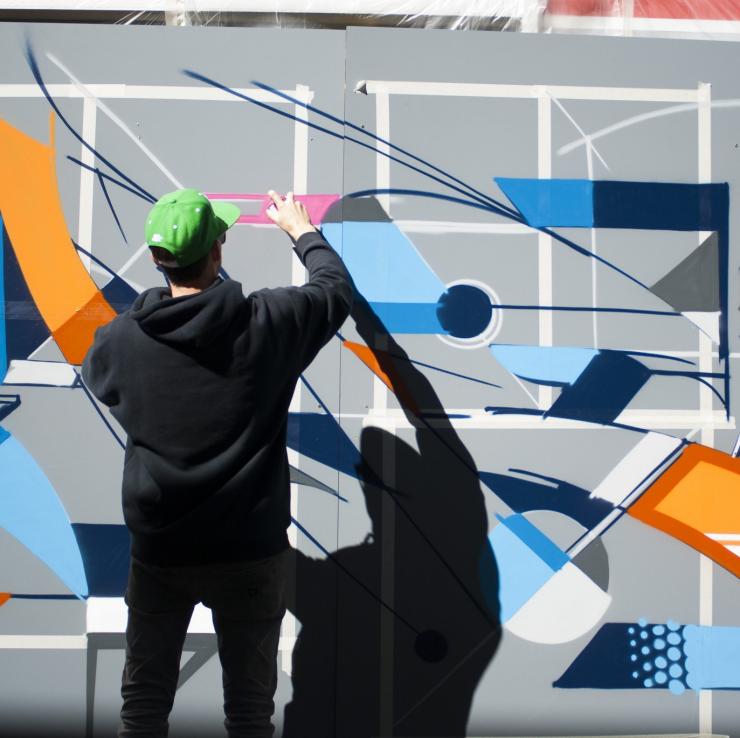 Vans the Omega graffiti artist at work in the Canberra Museum and Gallery courtyard, Canberra, Australian Capital Territory © Martin Ollman, VisitCanberra