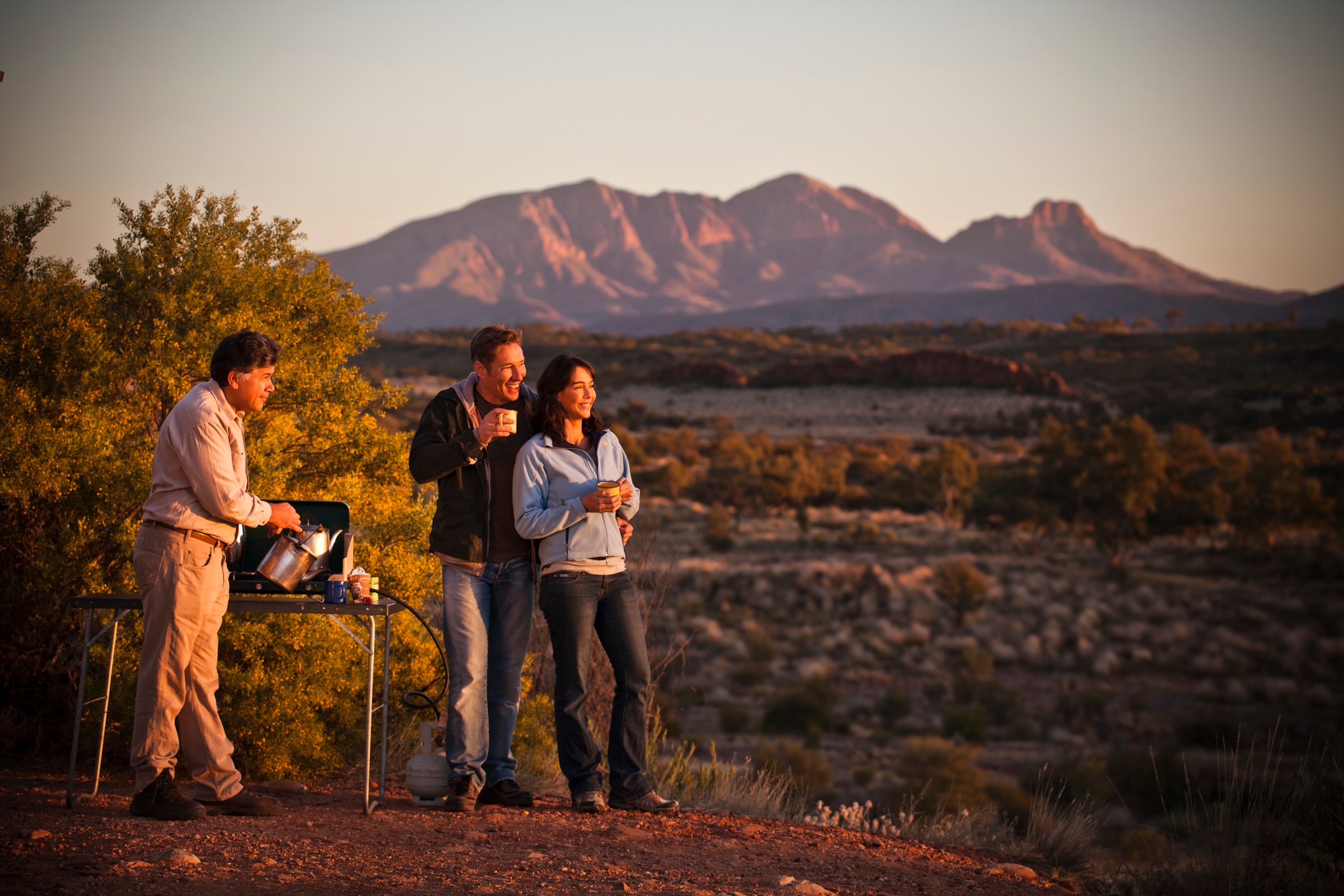 Couple admire the outback landscape near Alice Springs © James Fisher/Tourism Australia