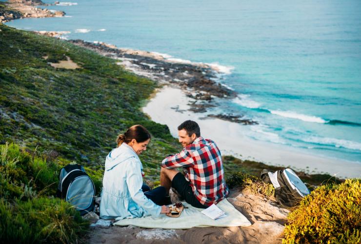 Walk into Luxury guests enjoying a gourmet lunch on the Cape to Cape track above Conto Spring Beach, WA © Tourism Western Australia and Walk Into Luxury 