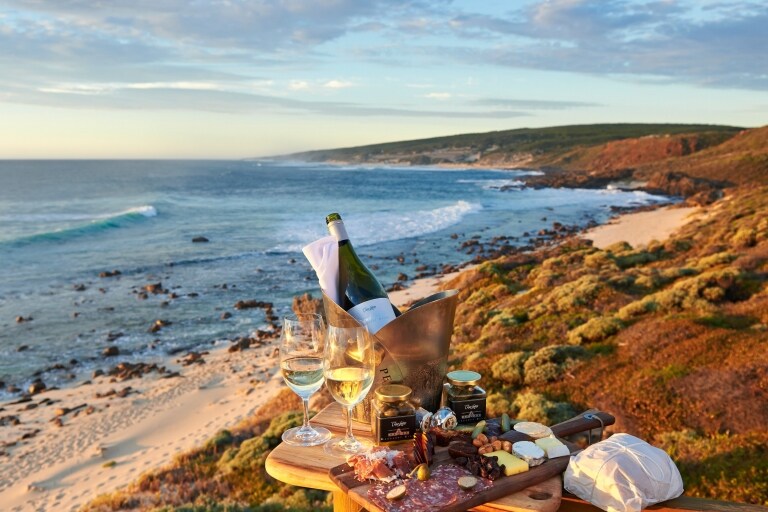 Platter of produce and wine at the beach, Cape Lodge, Margaret River, WA © Frances Andrijich