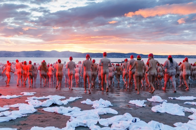  Swimmers on the beach for the Nude Solstice Swim in Hobart © Dark Mofo/Jesse Hunniford