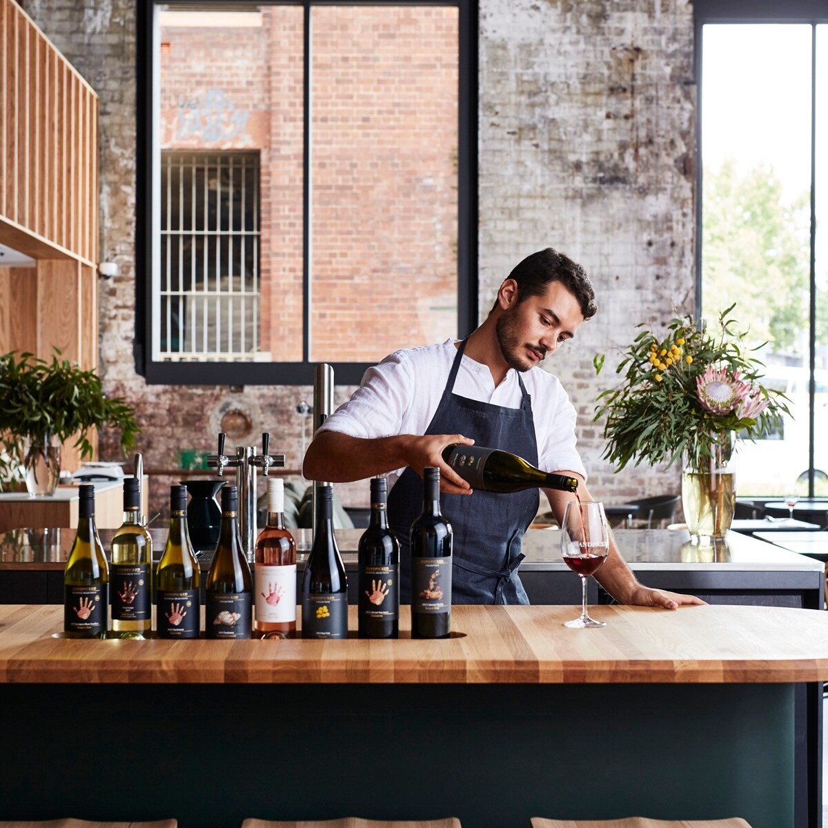 Bartender pouring wine at Handpicked Wines in Sydney © Handpicked Wines
