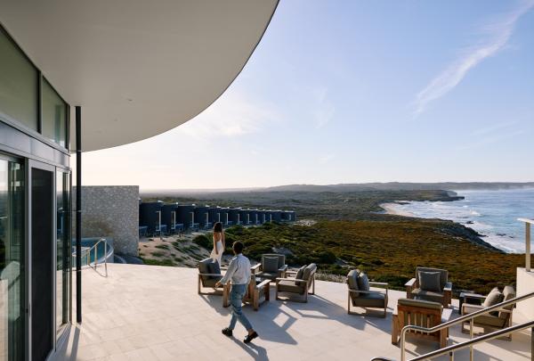 A couple enjoying the outdoor deck at Southern Ocean Lodge, Kangaroo Island, South Australia © South Australian Tourism Commission