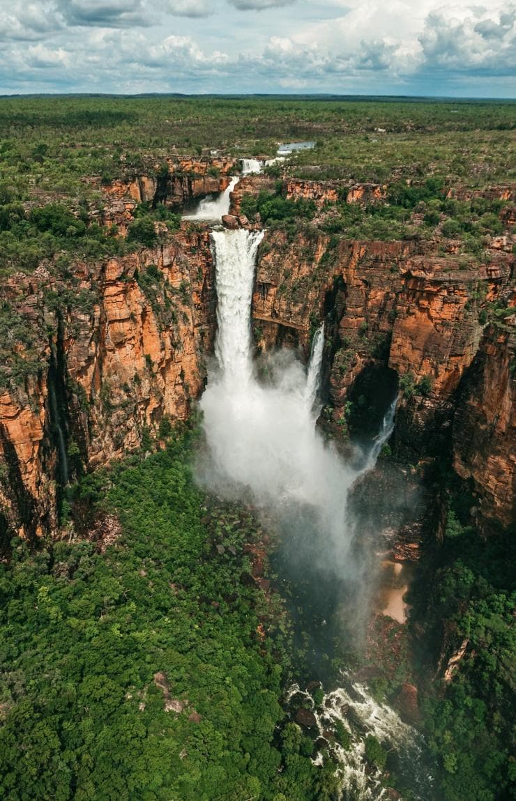 Aerial view over a large waterfall cascading off a cliff amid lush green bushland, Jim Jim Falls, Kakadu National Park, NT © Jarrad Seng, all rights reservedJim Jim Falls, Kakadu National Park, NT © Jarrad Seng, all rights reserved