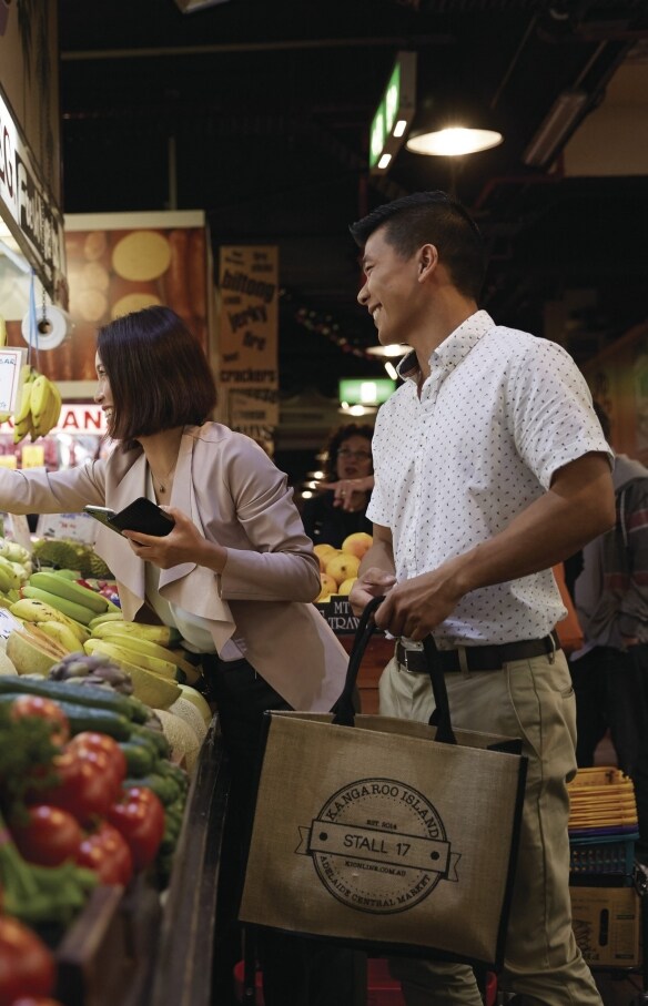 Couple purchasing produce at the Adelaide Central Market , Adelaide, South Australia © Ryan Cantwell