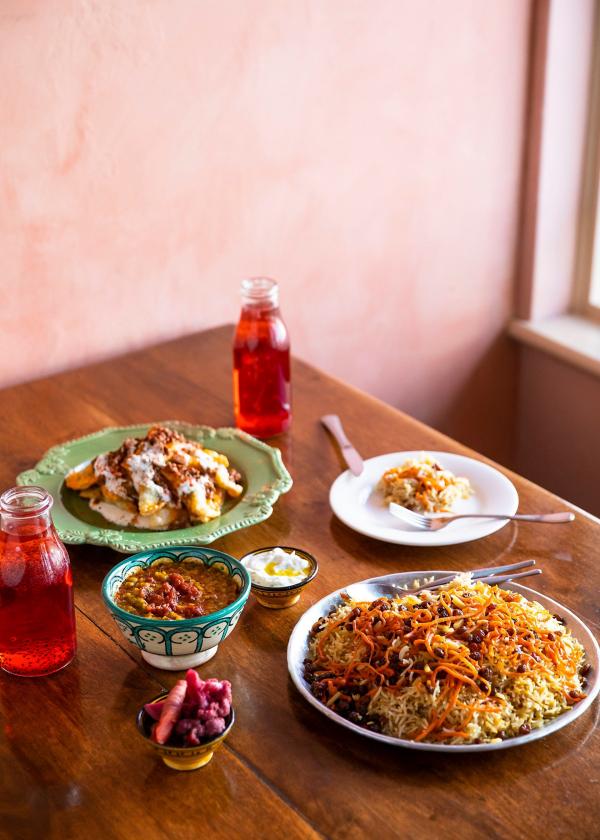 Colourful plates of food set on a table at Parwana Afghan Kitchen, Adelaide, South Australia © Josie Withers